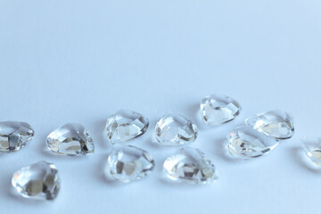 Diamonds on a white background. Macro photo with shallow depth of field.
