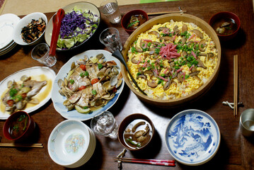 A colorful chirashi sushi dish for Hina Matsuri in Japan, topped with egg, mushrooms, pink pickles, and greens. It's a festive and vibrant meal celebrating the Doll Festival with tradition and taste.