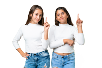 Friends girls holding gift and a birthday cake over isolated chroma key background showing and lifting a finger in sign of the best