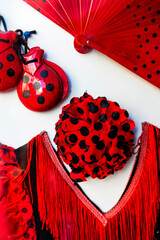 Detail of a vibrant polka dot flamenco dress, emblematic of Spanish dance and festive celebrations,...