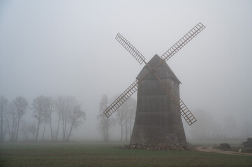 Kozlak windmill in the fog in Boruja Koscielna, Poland