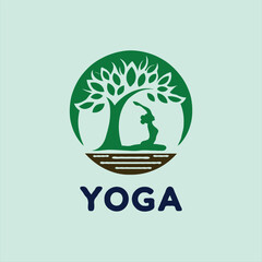 a yoga logo with a tree and a person doing yoga