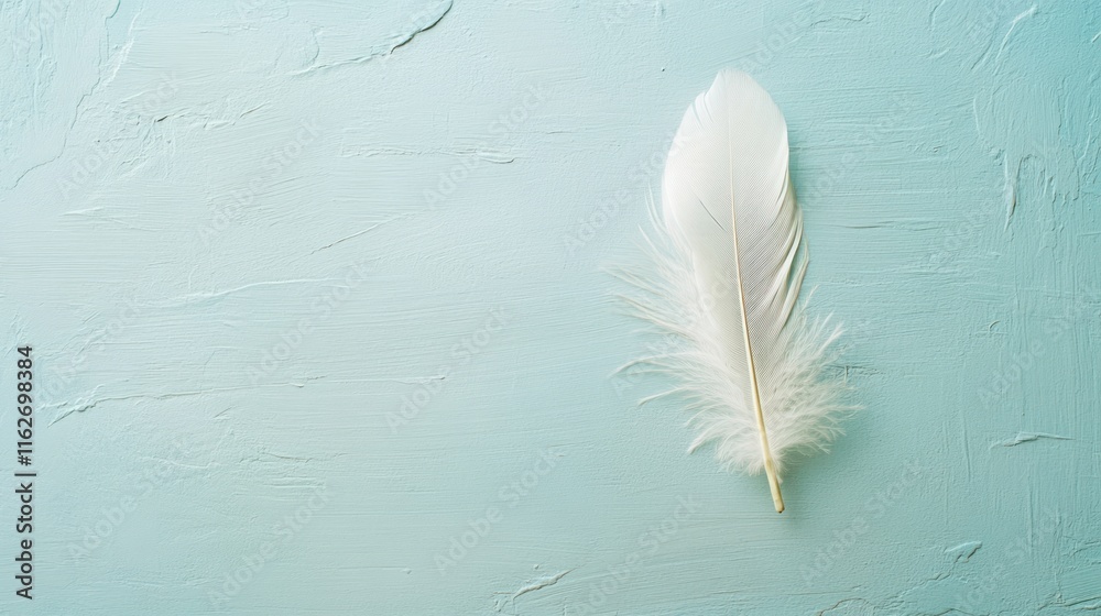 Poster a delicate white feather resting on a soft blue background, evoking tranquility and serenity.