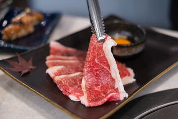 Premium marbled luxury sliced wagyu beef meat for yakiniku grilled steak sukiyaki
