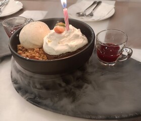 cream with chocolate, Ice cream with candles Serve in plate with dry ice