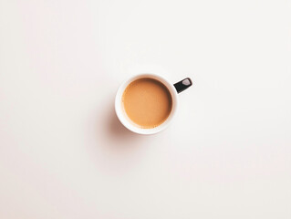 Top View of Coffee in a Minimalist Cup on White Surface