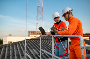 Two engineers are planning to install solar cells on the roof of a building.