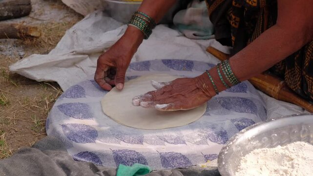 25 December 2024, Pune, India, Women Preparing mande ( PURAN POLI ) - typical Maharashtrian Sweet food in Bhimthadi Jatra, Pune, To uplift the culture and traditional Food with an active platform.
