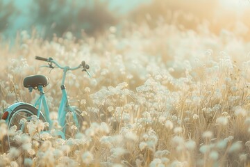 Naklejka premium Vintage bicycle in the field with white flowers, retro toned