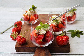 Strawberry desert in a glass, yummy desert, fresh strawberry dessert with cream