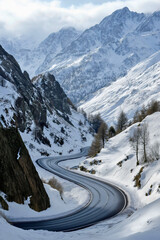 Obraz premium Winding winter road through snowy mountain landscape, scenic forest highway journey concept, frozen rural countryside scene