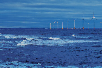 Offshore Wind Turbines and Ocean Waves in Redcar, UK.