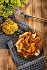Beef stew in gravy, served with potato dumplings.