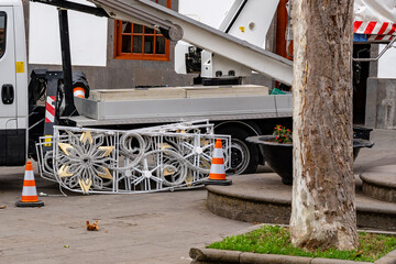 A truck is parked in front of a tree
