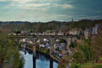 Fototapeta premium Stone Viaduct Over River and Village in Knaresborough, UK.