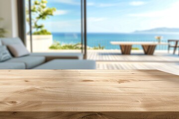 A light wood table in front of a blurred background of a luxurious living room overlooking the ocean.