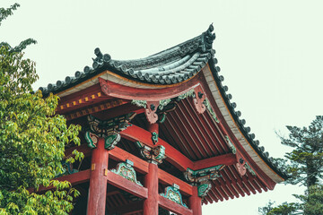 Fototapeta premium Detail of a traditional japanese rooftop. Buddhist temple architecture.