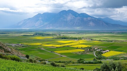Obraz premium Scenic Mountain Ranges with Green Valley Landscape