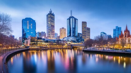 Naklejka premium Twilight City Lights with Scenic River Reflection