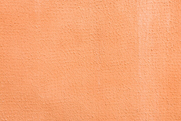 Abstract background of distressed plaster on the wall.