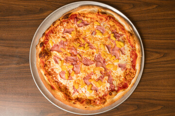 Pizza with ham and pineapple