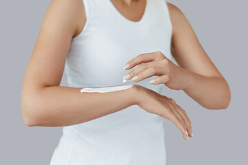Hand Skin Care. Close Up Of Female Hands Holding Cream Tube, Beautiful Woman Hands With Natural Manicure Nails Applying Cosmetic Hand Cream On Soft Silky Healthy Skin. Beauty And Body Care Concept