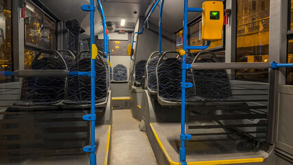 Empty city bus interior at night, highlighting urban transportation challenges and the concept of sustainable public travel infrastructure