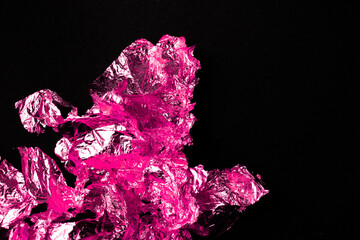 An abstract composition of crumpled metallic foil, bathed in pink hues. It evokes icy textures and...