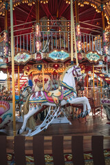 Fototapeta premium Carousel with colorful horses, Merry go round with horse, Vintage ride attraction for children