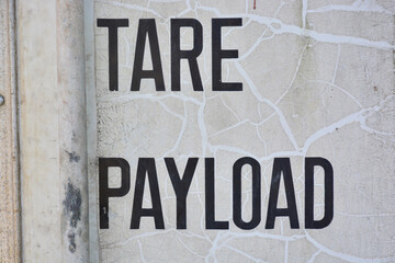 Fototapeta premium black number and letters Tare and payload cargo load on a white background