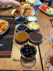 Rich and delicious Turkish breakfast on wooden table