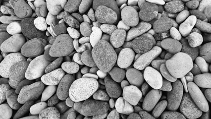 abstract black and white background with many round pebble stones
