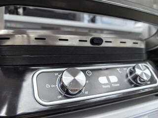 Fototapeta premium Exploring the intricate design of a modern kitchen appliance in close-up