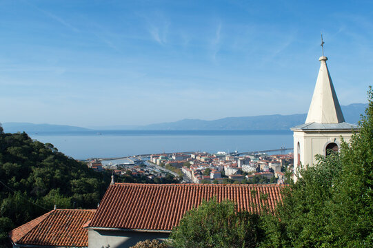 Rijeka, Croatia, a panoramic view over the city, church with bell tower, beautiful Adriatic sea and Ucka mountains