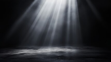 A dramatic light beam illuminating a dark, misty space, creating an atmospheric effect.