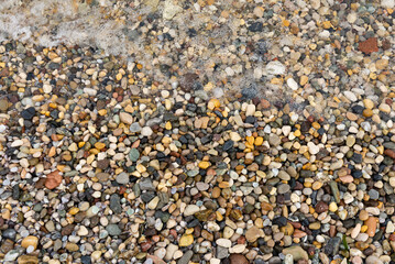 Background made of Sea or river pebbles. Natural texture of beach pebbles.