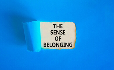 The sense of belonging symbol. Concept words The sense of belonging on beautiful white paper. Beautiful blue table blue background. Business and the sense of belonging concept. Copy space.