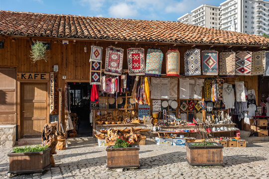 Old Bazaar in Kruje Albania with stalls selling handmade colorful carpets, souvenirs and traditional local crafts