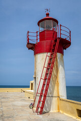 Photo of the lighthouse at the Forte de São Sebastião in Sao Tome in Africa on a clear, sunny day