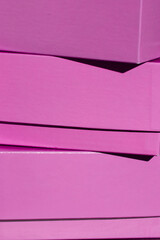 Close-up photograph of stacked boxes. Packaging design.