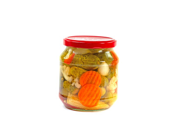 Mixed pickles in a preserving jar against a white background