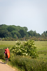 Carrying a canoe along the towpath