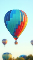 Naklejka premium heic Thumbnail Squarespace designer Avif protobuf Webp Telegram channel Dezgo Nitropack Togetherall Colorful hot air balloon floating in clear blue sky over scenic landscape, perfect for travel, adve