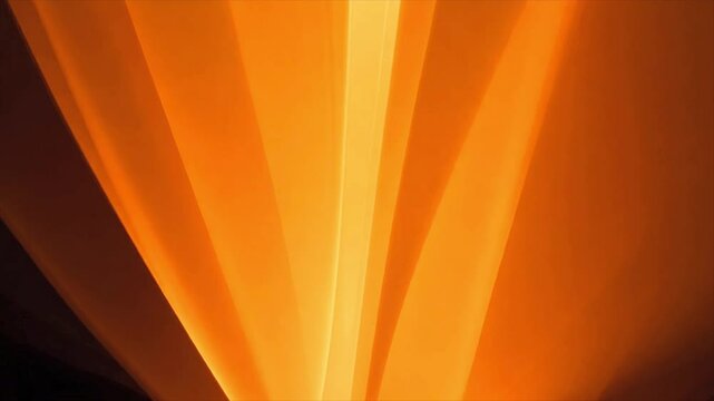 Soft glowing orange light rays forming an abstract pattern with a warm atmospheric effect. Dynamic animation with modern design
