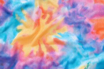 Fototapeta premium Abstract tie dye multicolor fabric cloth Boho pattern texture for background or groovy wedding card, sale flyer, 60s, 70s poster, kid tie-dye diy backdrop. Modern Watercolor Wet Brush Fabrics Art