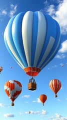 Fototapeta premium Blue and white striped hot air balloon floating with orange and red balloons in clear sky for adventure travel, festival, outdoor activity, summer vacation, scenic aerial view, bright clouds backgrou