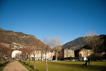 park outdoor square in andorra on sunny day to play with children on lawn