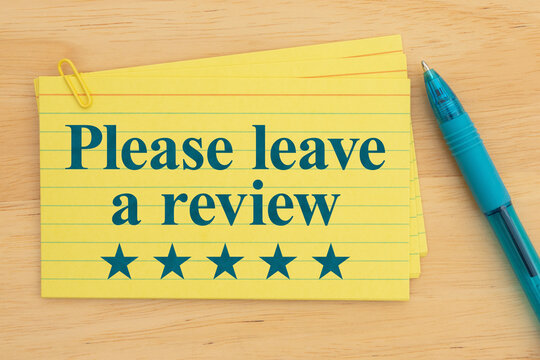 Yellow index cards with please leave a review text and blue pen