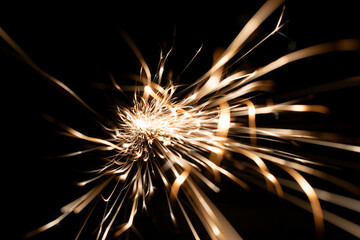 sparks from the grinder glowing in the dark