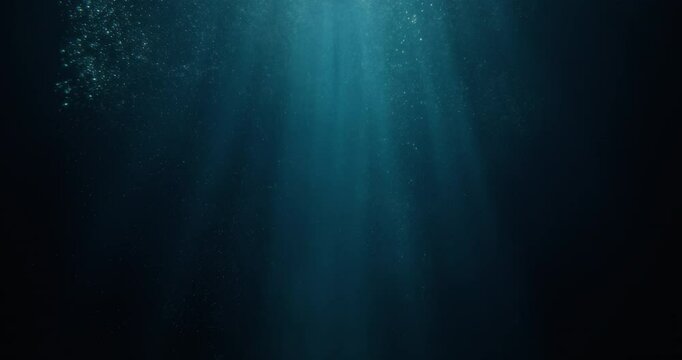 Long high-speed loopable 4K film slow-motion footage of underwater rays piercing ocean surface.  Enchanting beams of light flickering, ideal VFX background for vacation, snorkeling, summer adventures